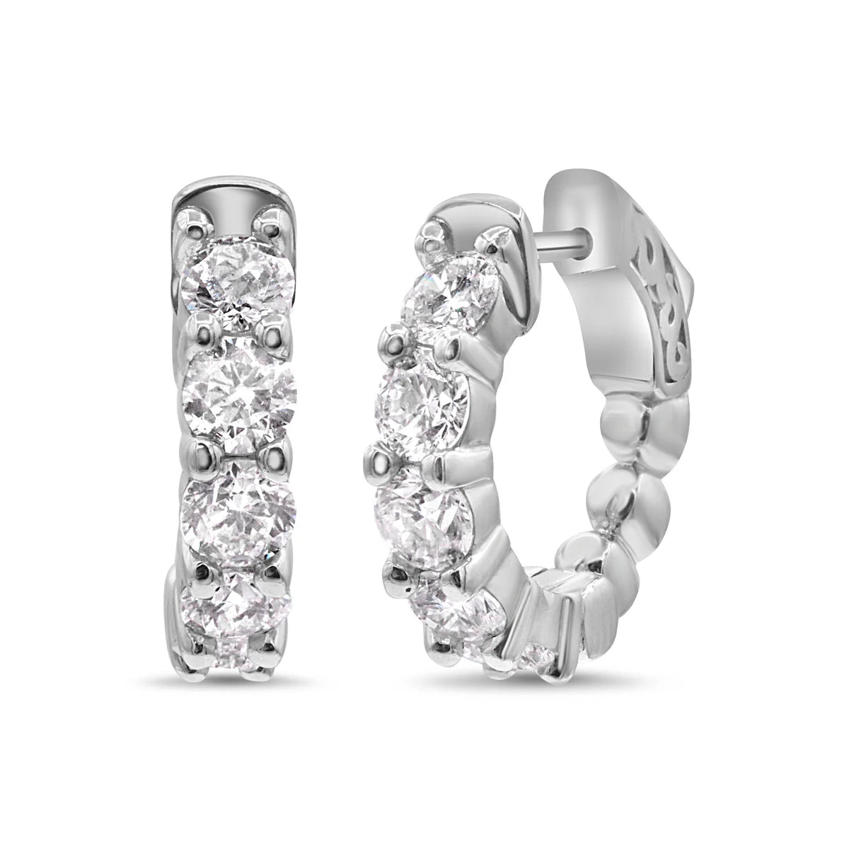 Silver hoop earrings with clear gemstones on a white background