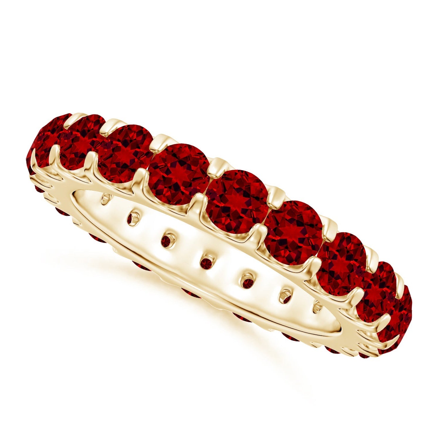 Gold ring with red gemstones on a white background