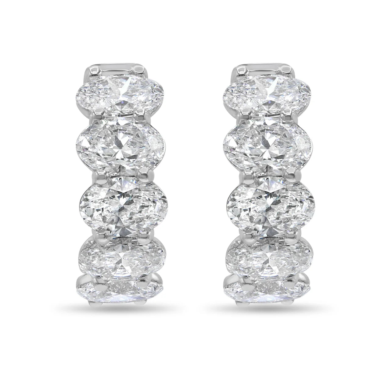 Pair of diamond earrings on a white background
