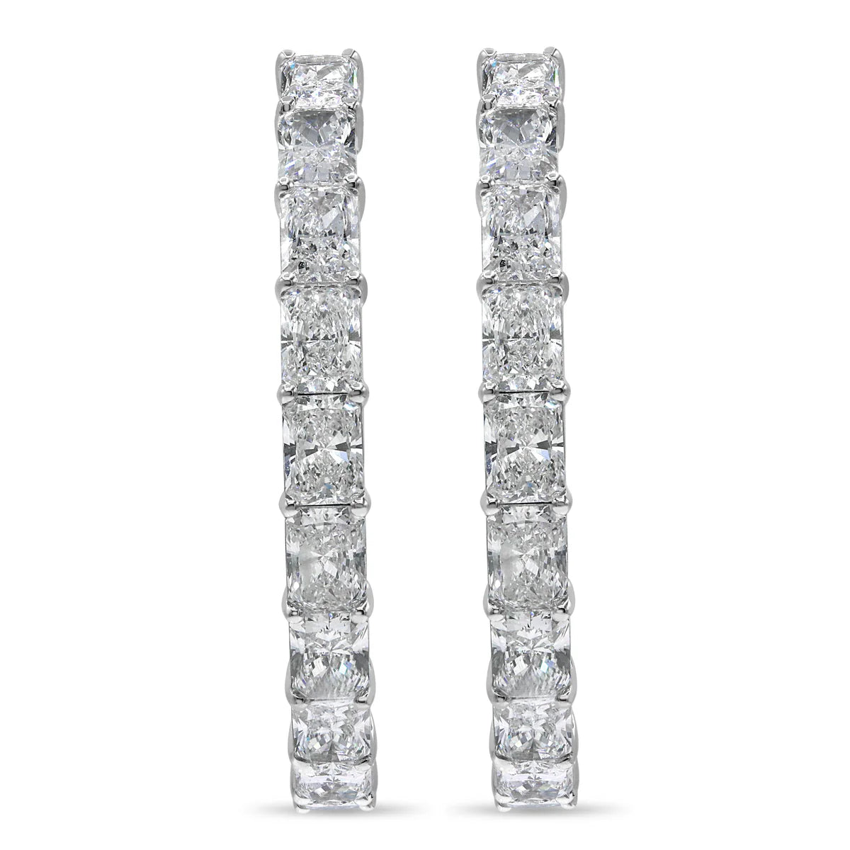 Pair of diamond hoop earrings on a white background