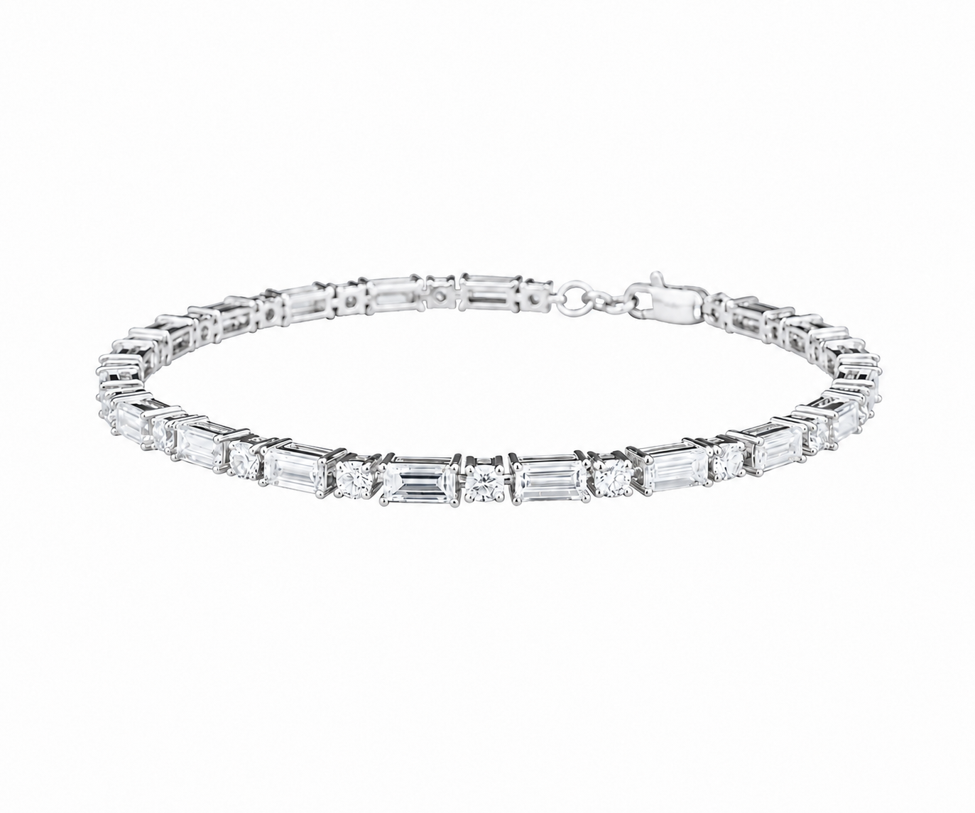 A silver tennis bracelet featuring baguette and round-cut clear stones, displayed against a solid white background.