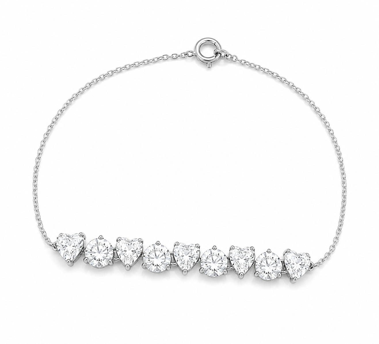 A delicate silver chain bracelet featuring a horizontal row of heart-shaped clear gemstones in a prong setting, displayed on a clean white background.