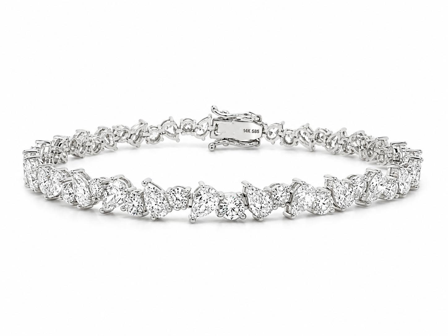 A diamond tennis bracelet in a silver-toned setting, arranged in a horizontal circle on a clean white background. The clasp is visible at the top center and features a small 'THE 818' hallmark.