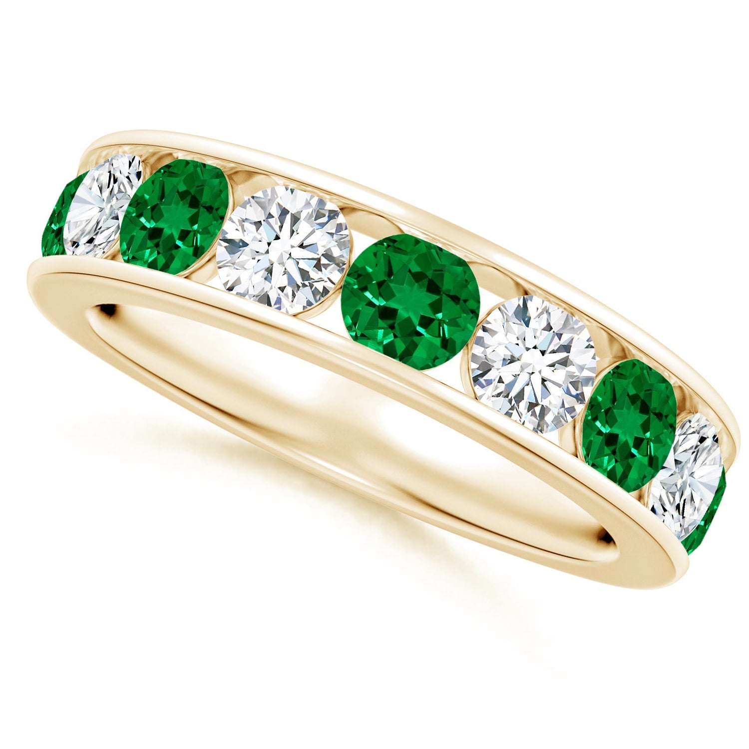 Gold ring with green gemstones and clear stones on a white background