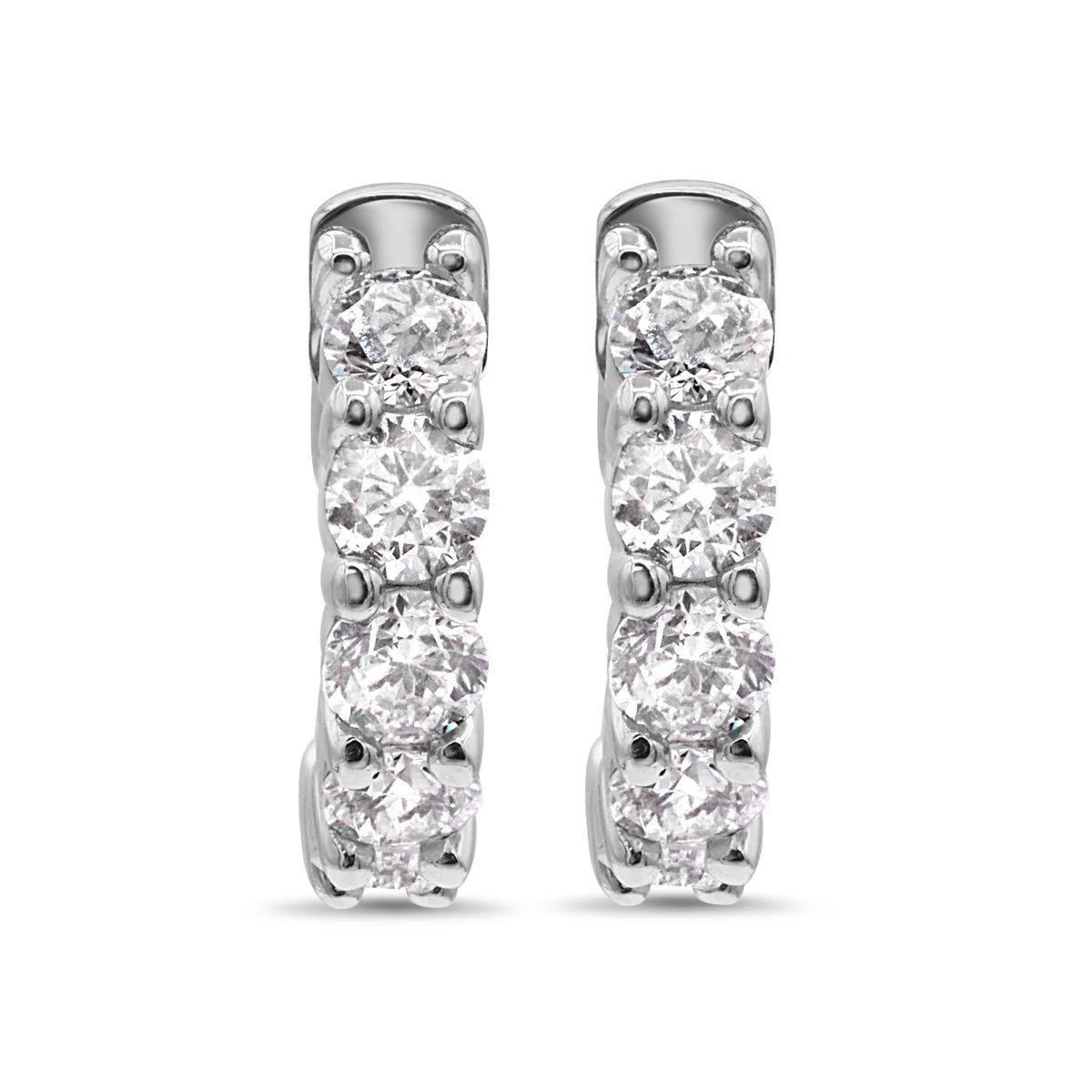 Pair of 14k white gold hoop earrings with clear diamonds on a white background