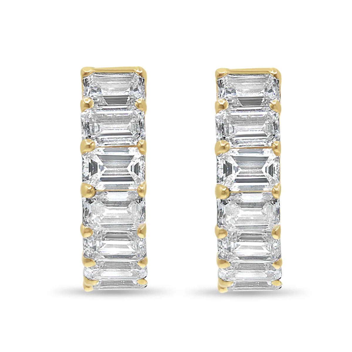 Pair of diamond earrings with 14 K YELLOW gold accents on a white background