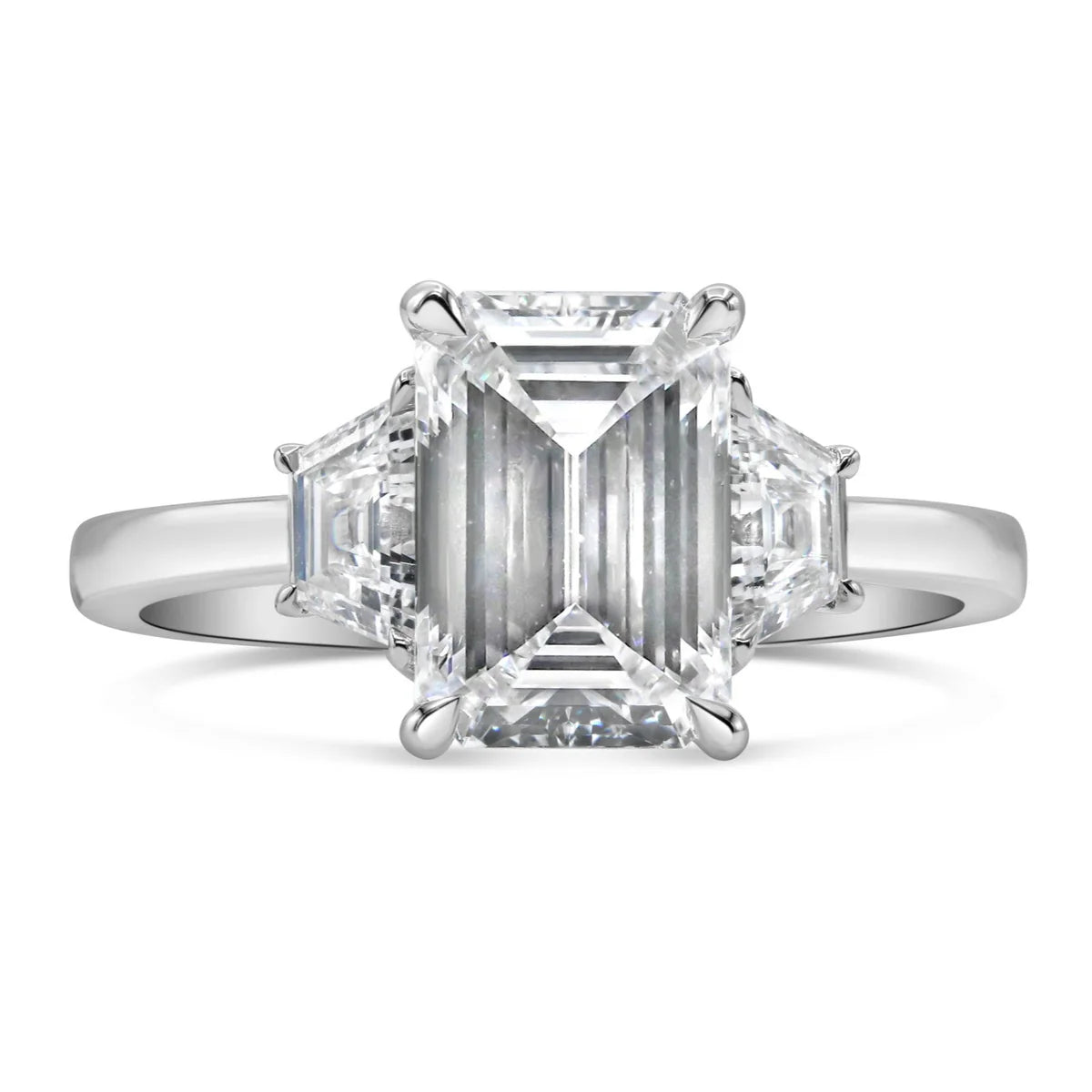 Emerald and Step Cut Trapezoid Three Stone Ring