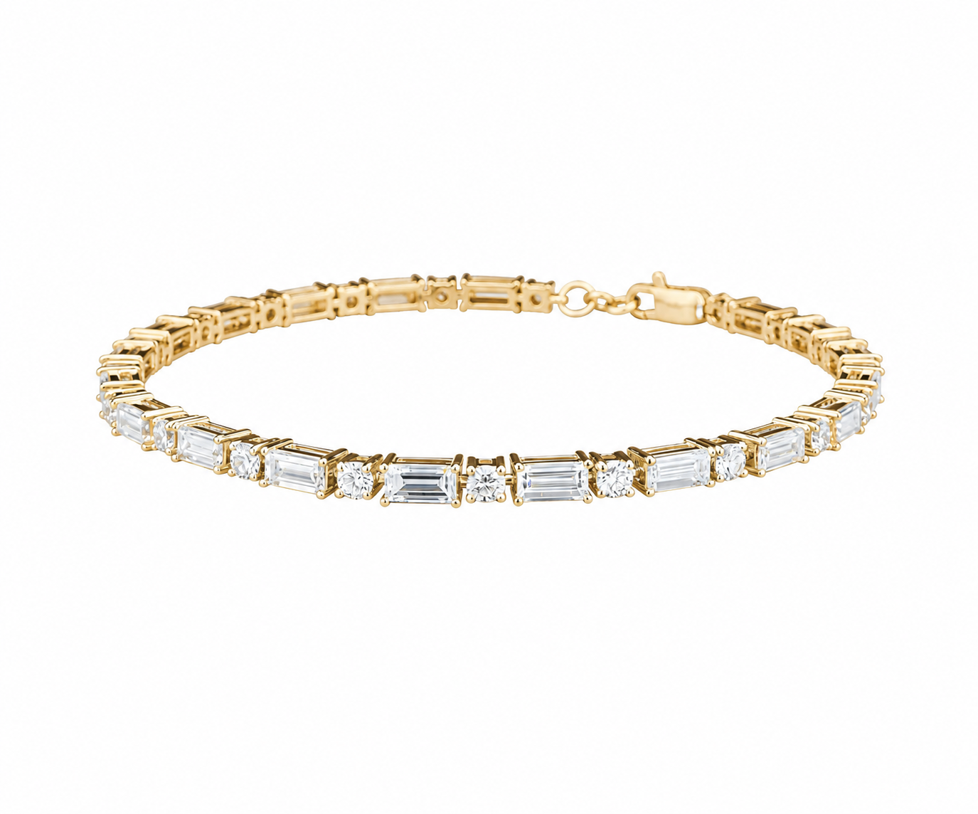 A yellow gold tennis bracelet featuring baguette and round-cut clear stones, displayed against a solid white background.