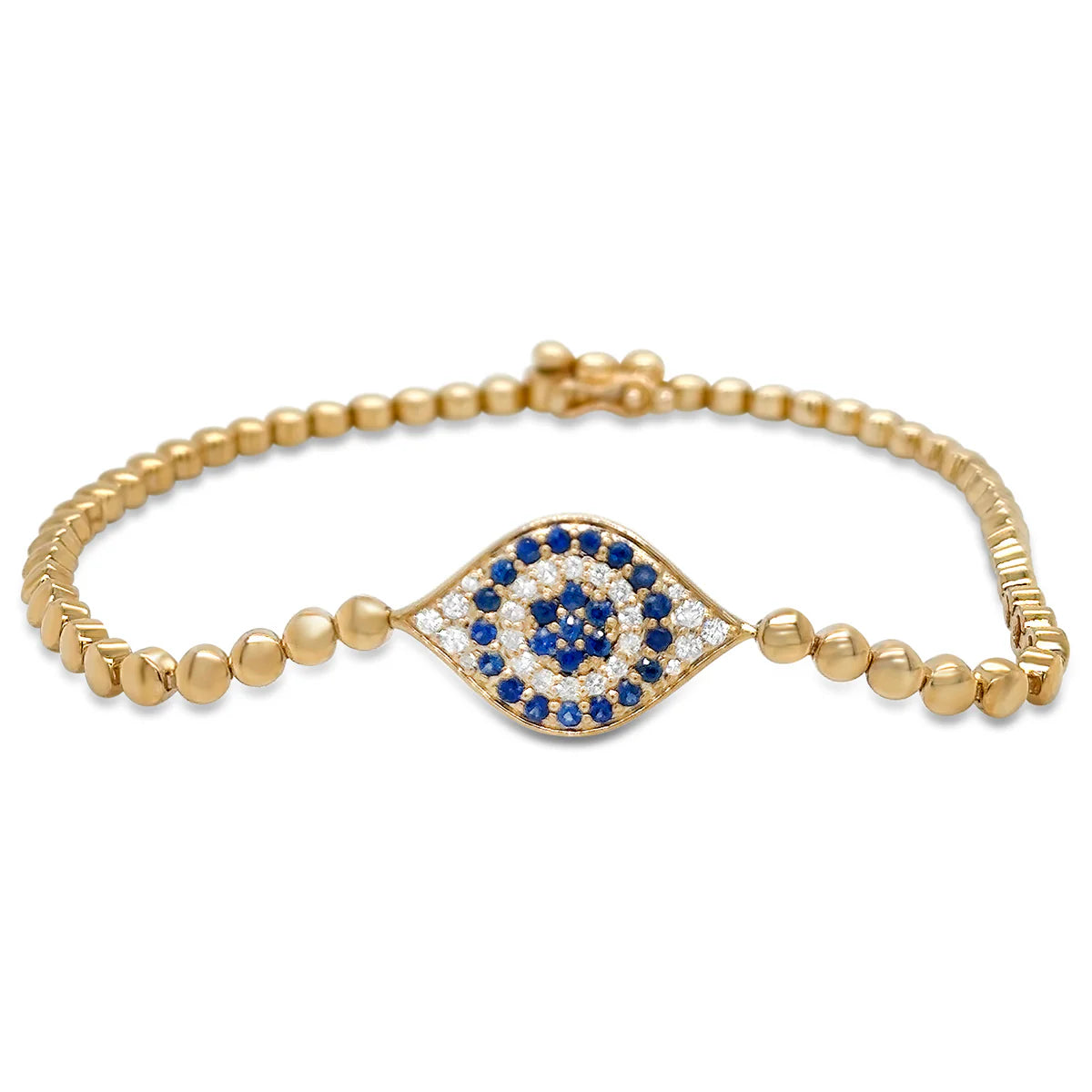 Gold bracelet with a blue and white evil eye design on a white background