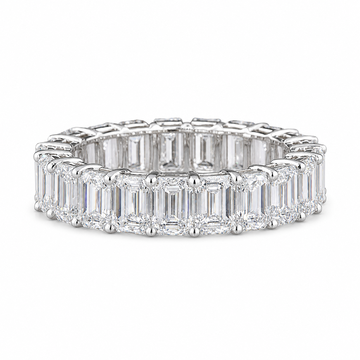 A 14k white gold eternity ring featuring a continuous row of baguette and round-cut diamonds, shown on a clean white background.