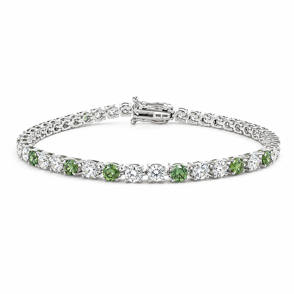 A silver tennis bracelet featuring round green peridot gemstones and clear round stones, displayed on a clean white background.