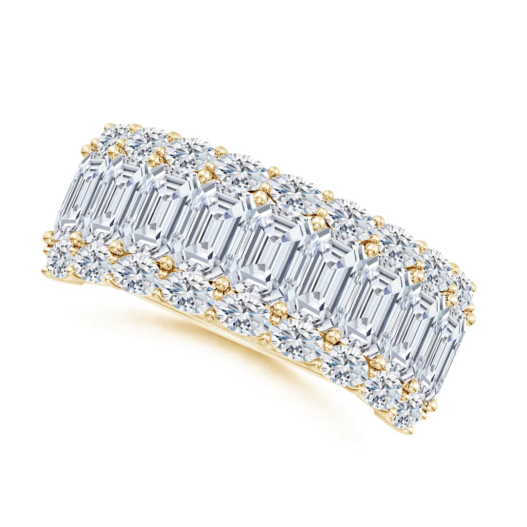 Diamond ring with emerald-cut stones on a white background