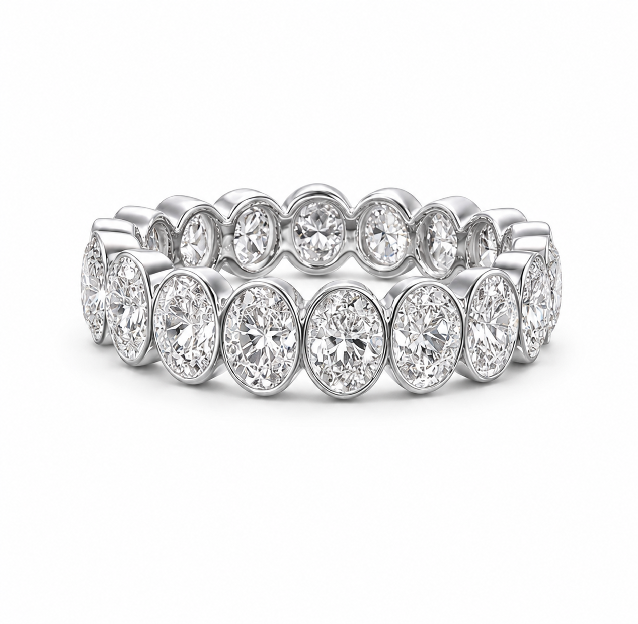A diamond eternity ring featuring round brilliant-cut diamonds set in a silver-colored metal band, shown on a clean white background.