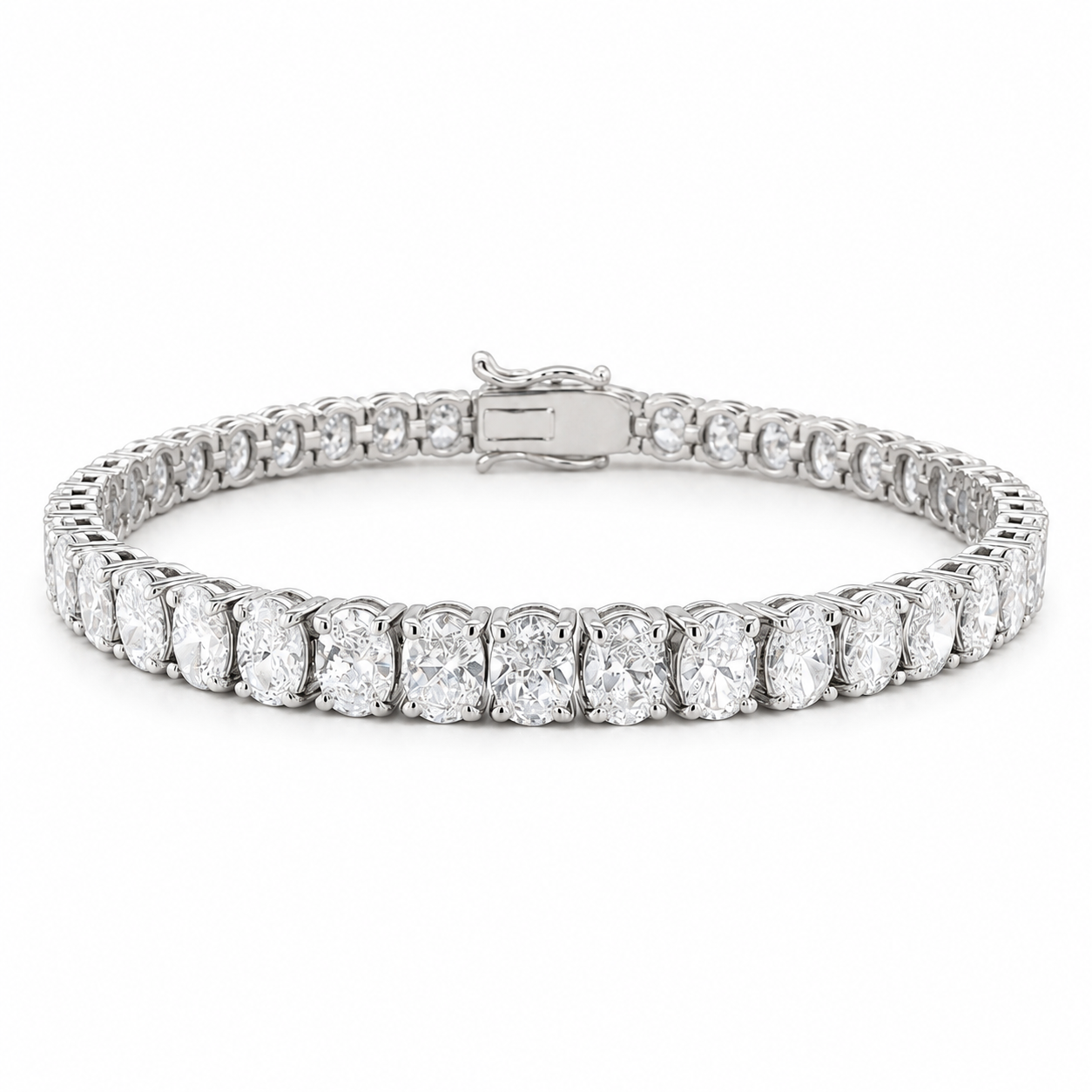 A tennis bracelet featuring a row of round-cut diamonds set in a silver-colored metal, shown against a plain white background.