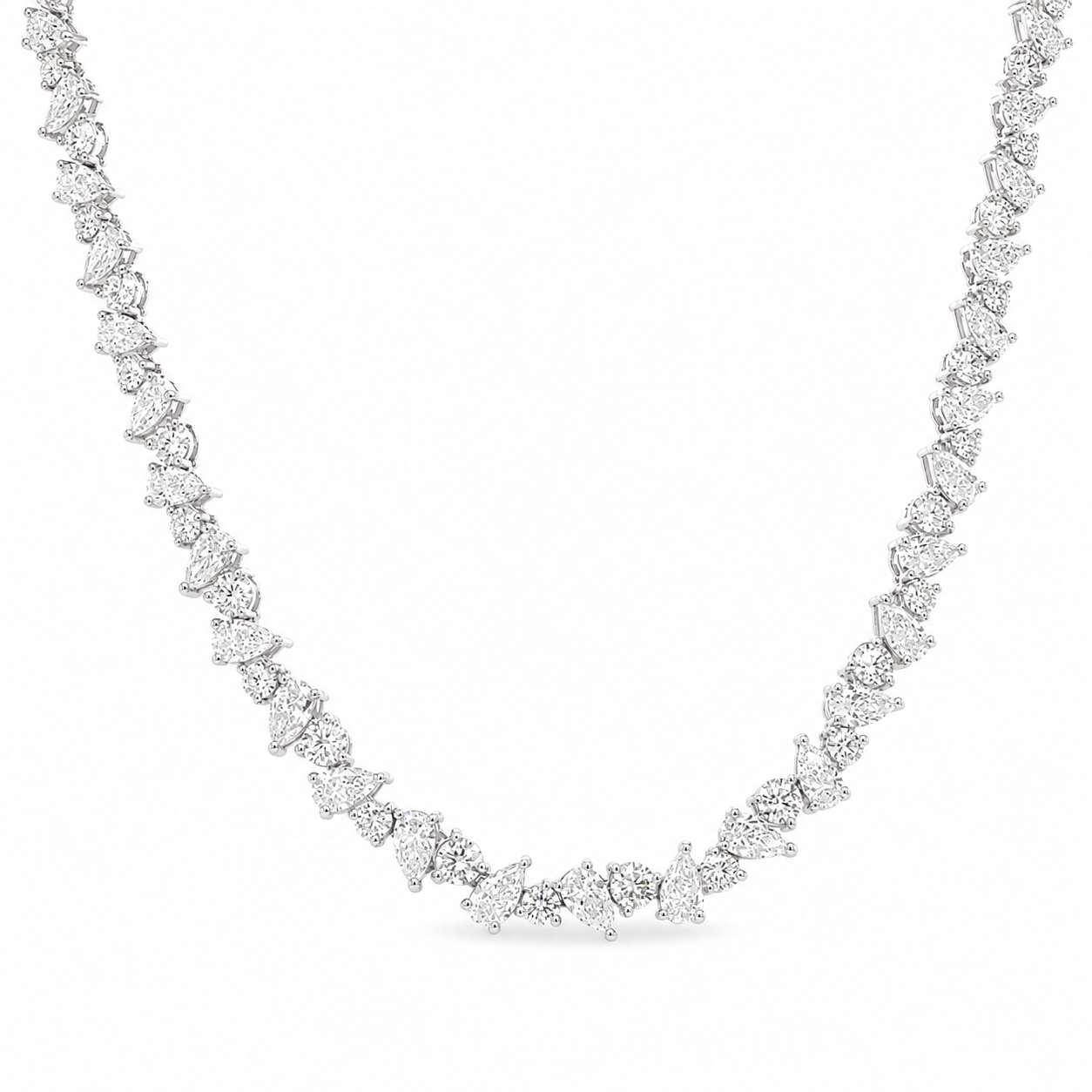 Gold chain necklace on a white background. Pear & Round Diamond Tennis Necklace, 17 ct.