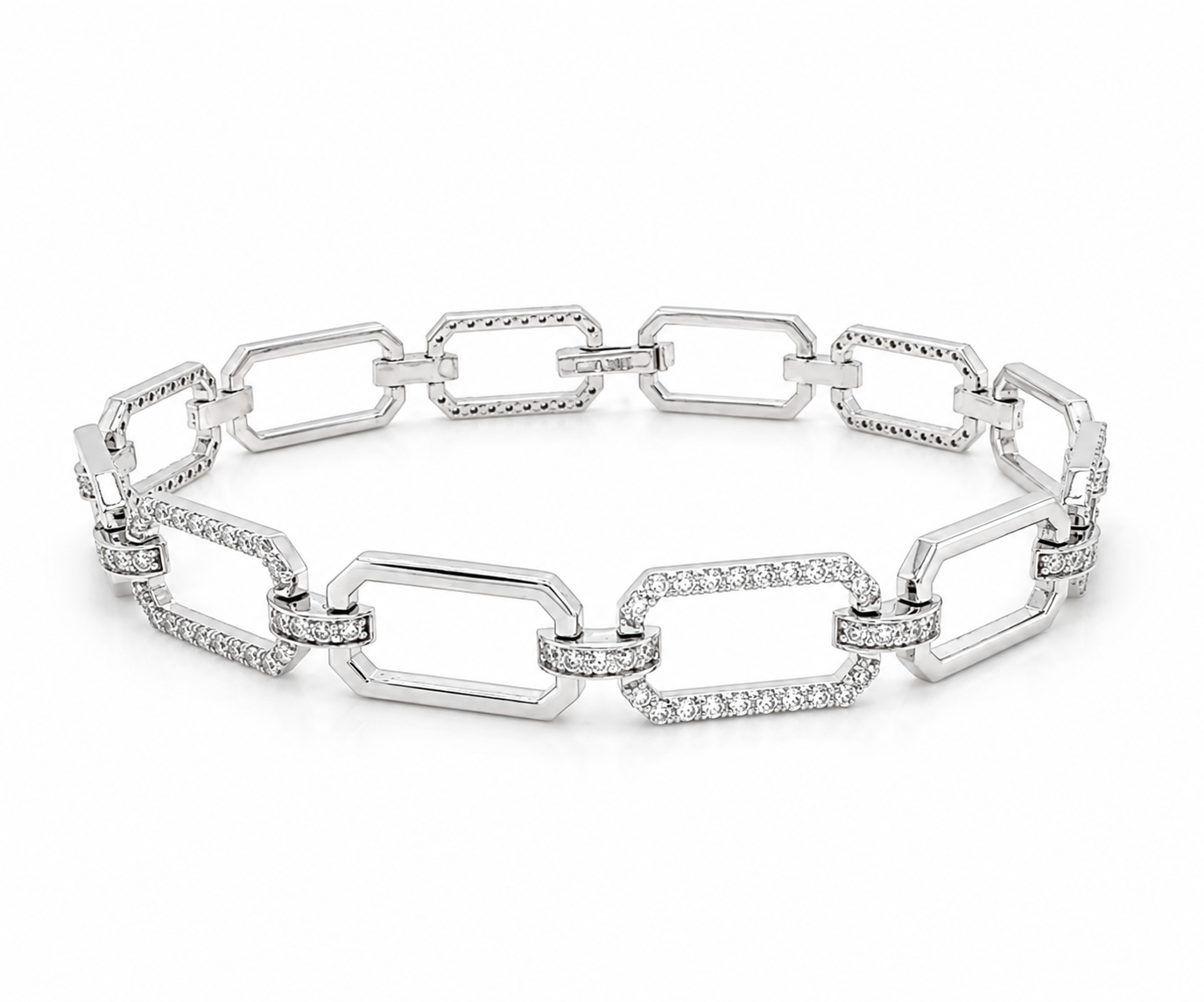 A silver-toned chain link bracelet featuring large elongated oval links, with pavé-set clear stones along the front of several links, photographed on a clean white background.