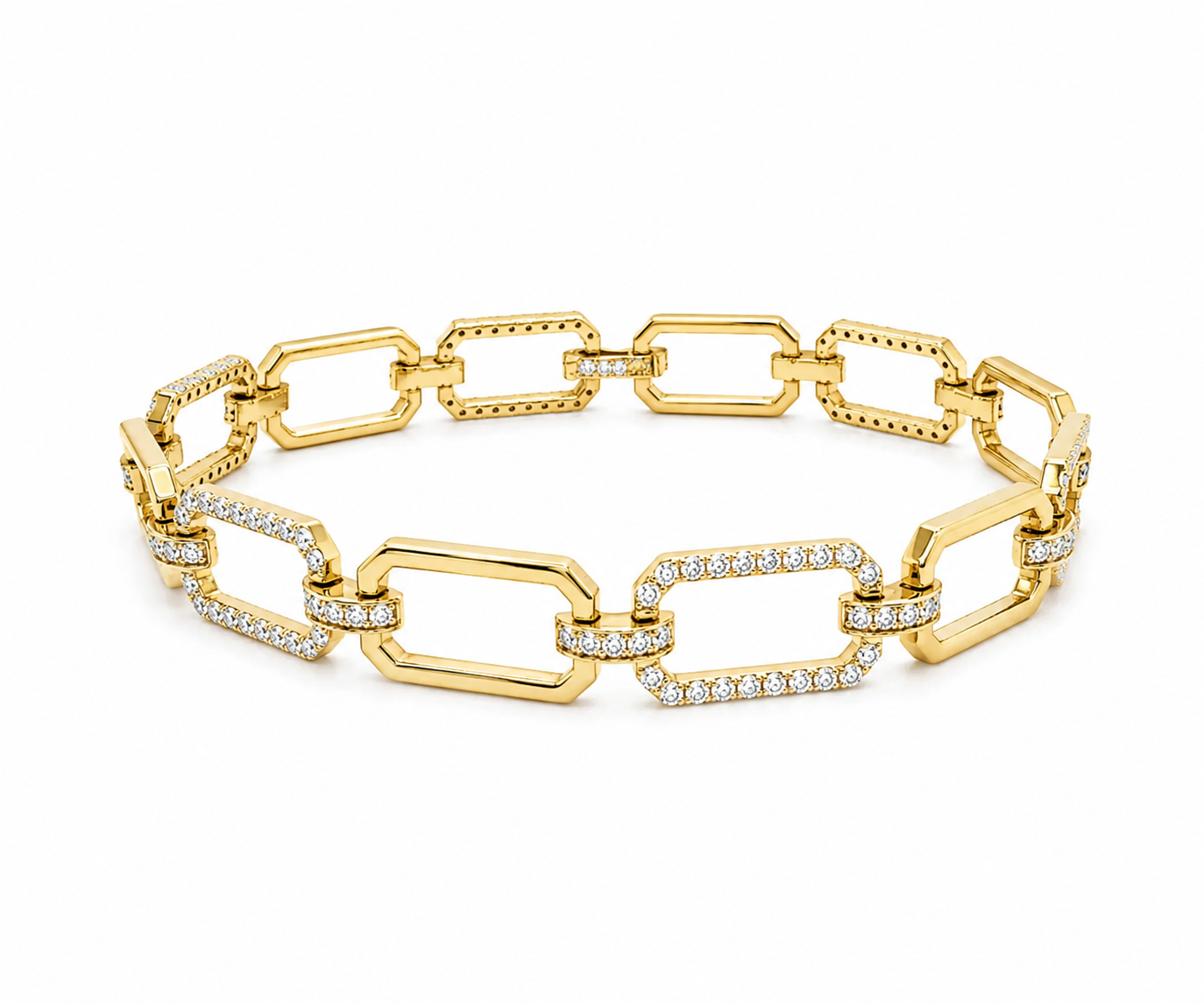 A yellow gold chain bracelet with alternating large rectangular links and smaller oval links, some of which are set with clear stones, photographed on a clean white background.