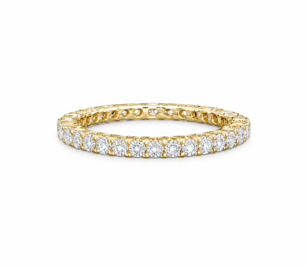 A yellow gold eternity ring featuring a continuous row of round-cut clear gemstones, shown on a clean white background.