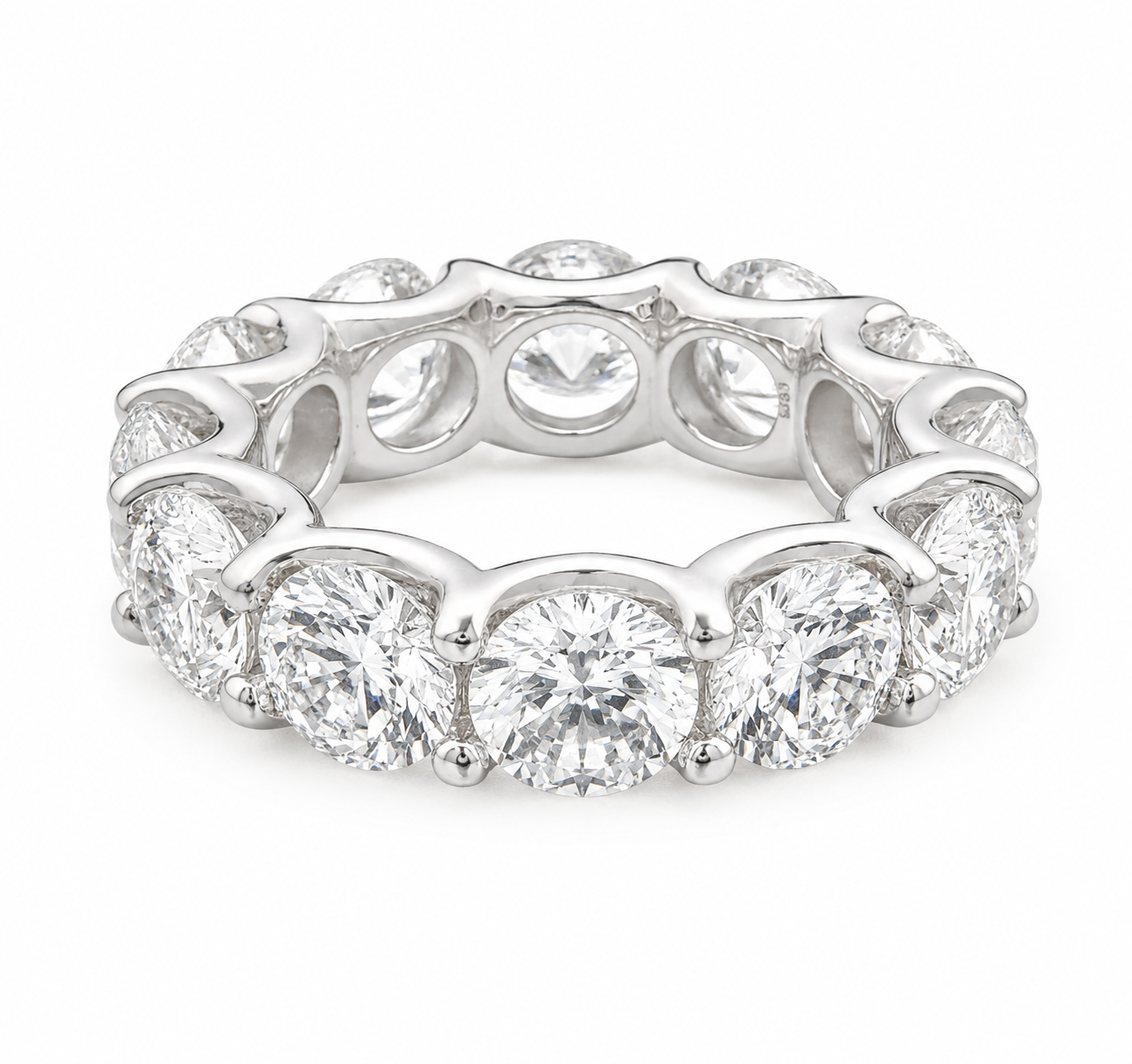 A silver diamond eternity band ring featuring a continuous row of round brilliant-cut diamonds in a polished silver setting, shown on a clean white background.