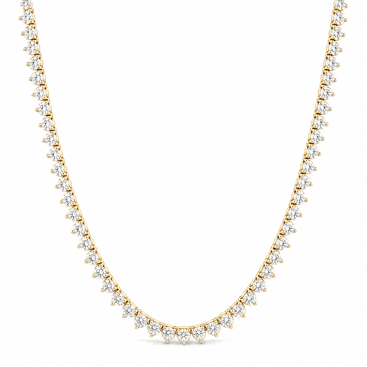 A delicate yellow gold tennis necklace paved with small clear round-cut gemstones, arranged in a U-shape on a solid white background.