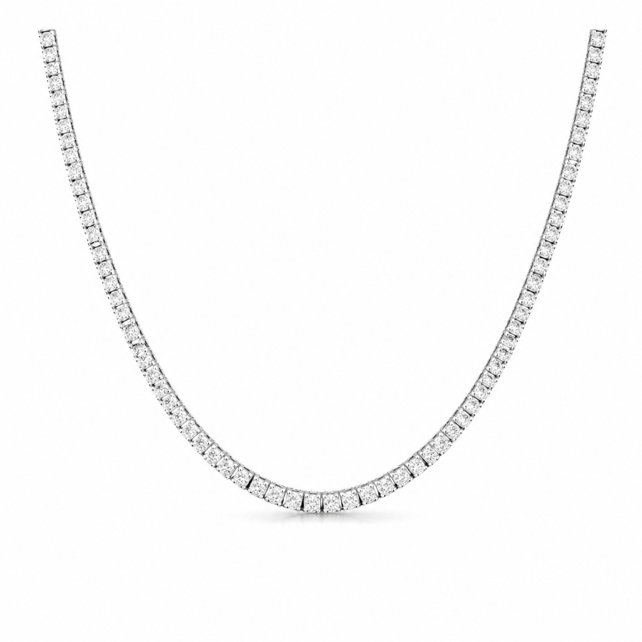 A tennis-style diamond necklace in a silver-toned setting, shown curved against a plain white background.