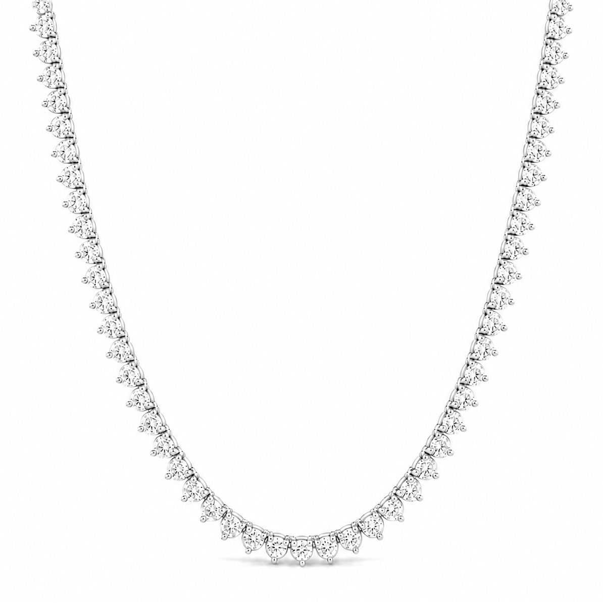 A silver tennis necklace paved with small clear round-cut gemstones, displayed in a U-shape against a solid white background.