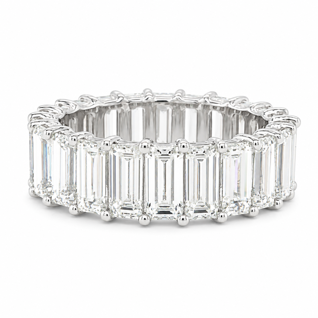 A 14k white gold eternity ring featuring a continuous row of clear baguette-cut gemstones in a prong setting, shown on a plain white background.